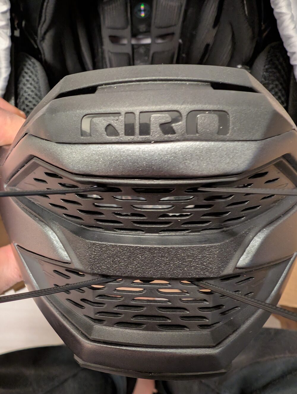 Giro Insurgent Spherical: zip ties threaded through the chin grille before the Zipmount goes on